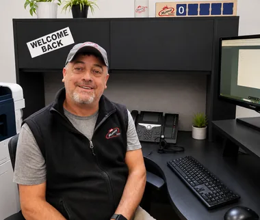 Munroe Dairy customer service representative Gil at his desk